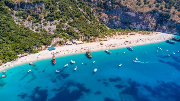Aerial view of a turquoise Albanian Riviera beach near Saranda