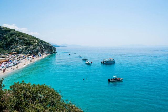 Gjipe beach and its canyon meeting the turquoise Ionian Sea on the Albanian Riviera