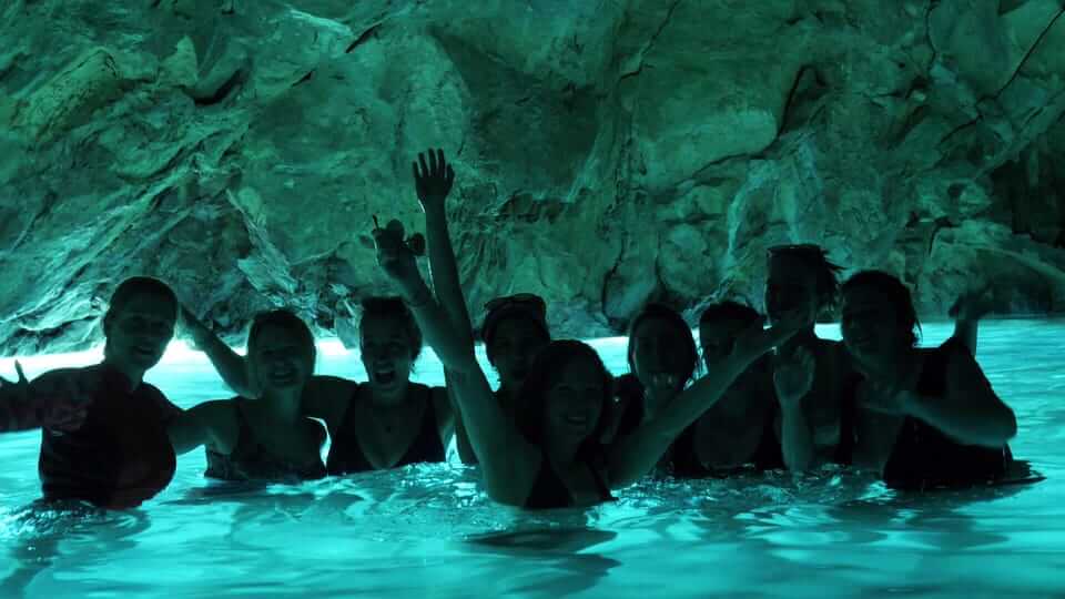 Blue Cave with vivid blue water near Paxos, Greece