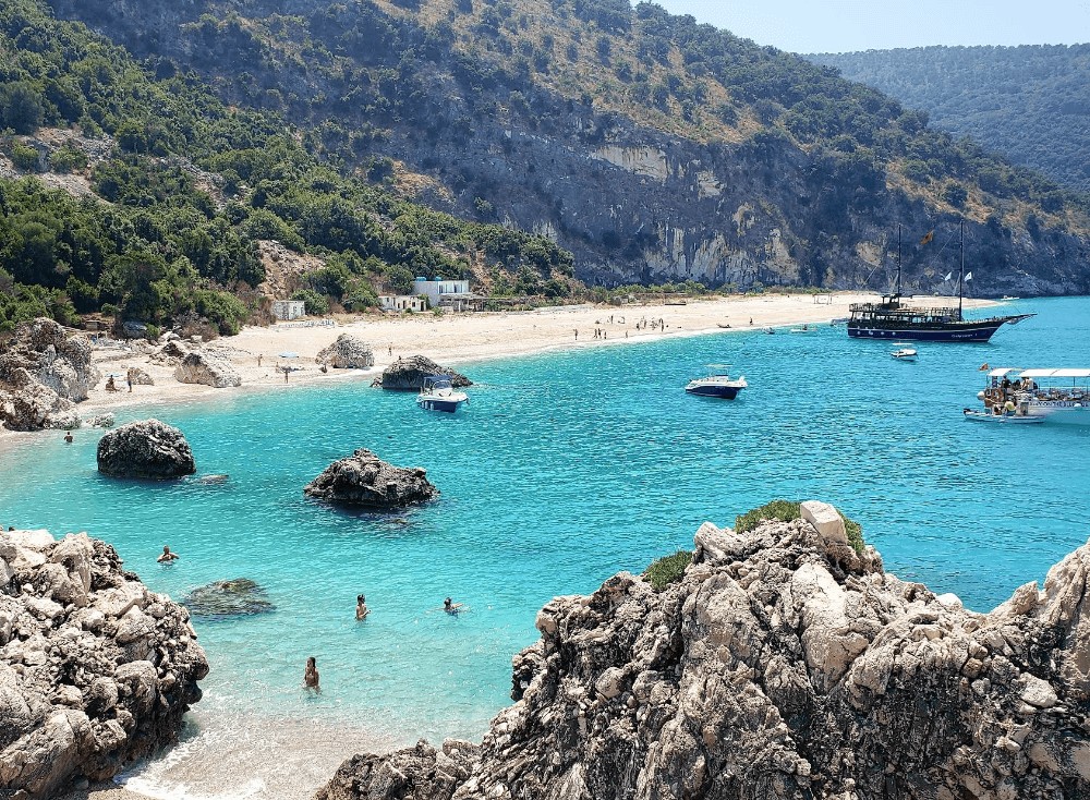 A pirate-style tour boat anchored off the Albanian coast