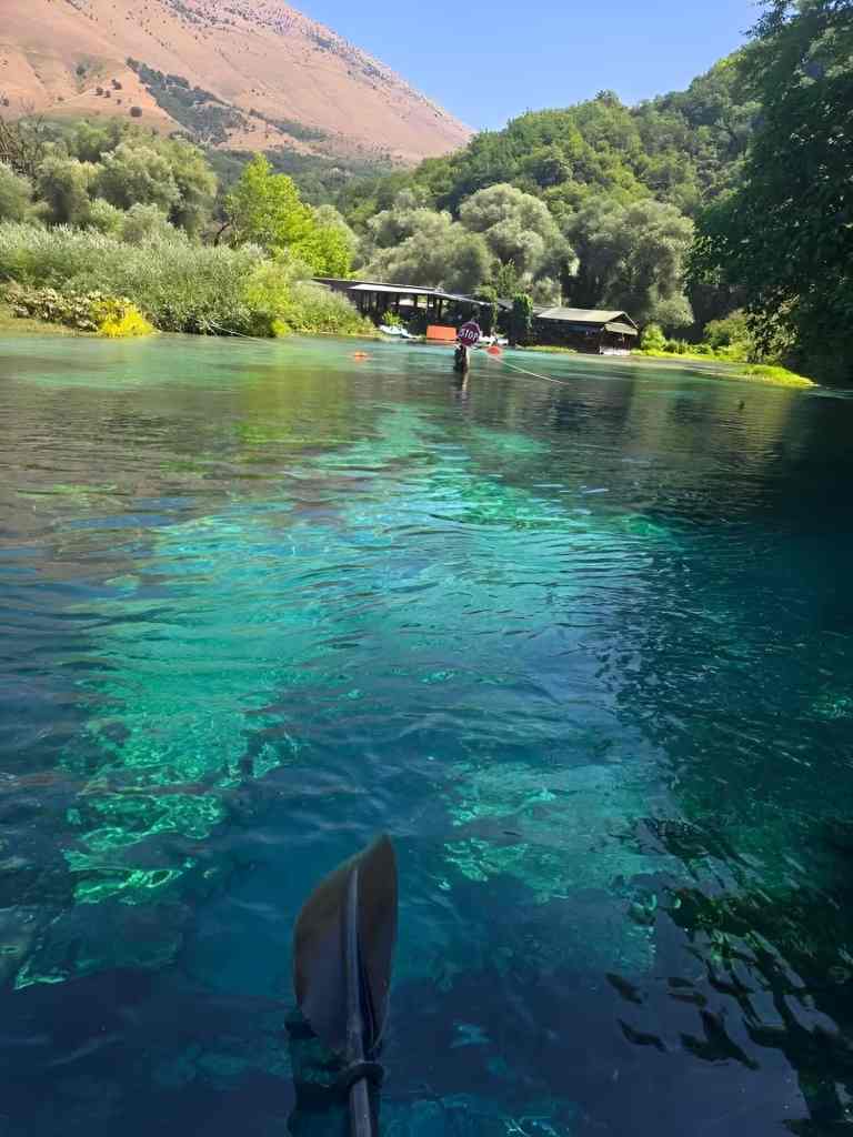 Clear turquoise water and submerged plants at the Blue Eye near Saranda