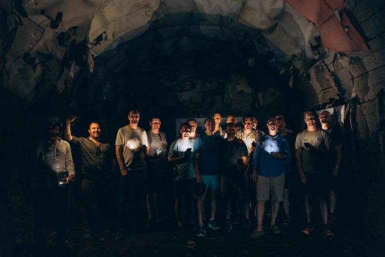 Group inside the old stone church at Cape of Rodon