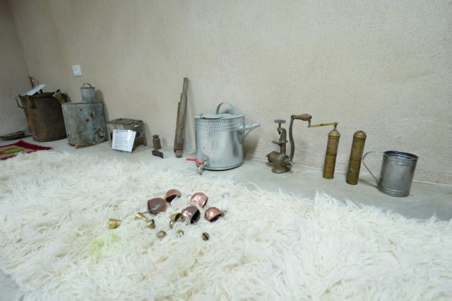 Old cheese-making and dairy tools displayed in a village museum in Lazarat