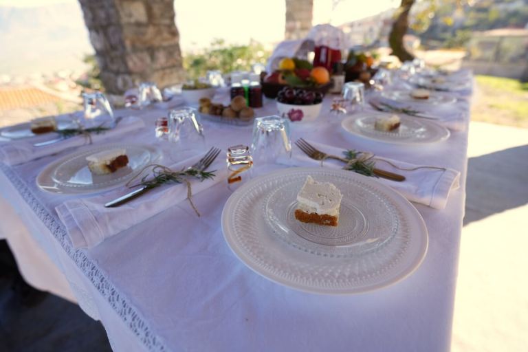 A spread of local cheeses on a rustic table in a village near Gjirokastra