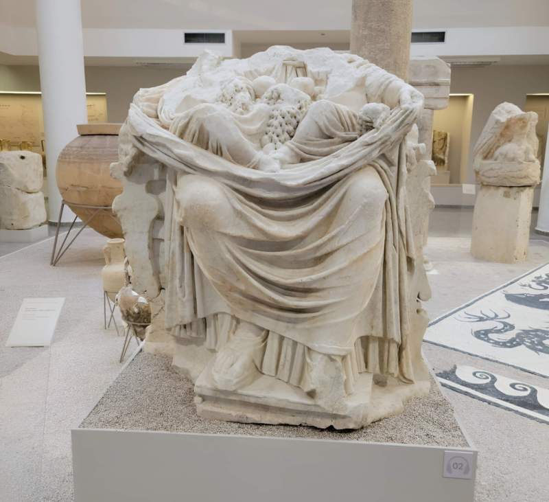 A carved Roman marble artifact in the archaeological museum of Durres on a Durres Ancient City day trip from Tirana