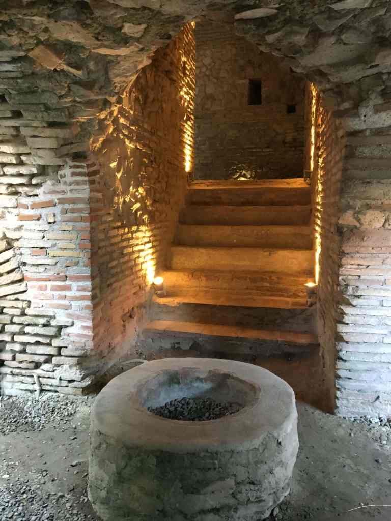 An underground vaulted passage with an old well in the Roman ruins of Durres, Albania