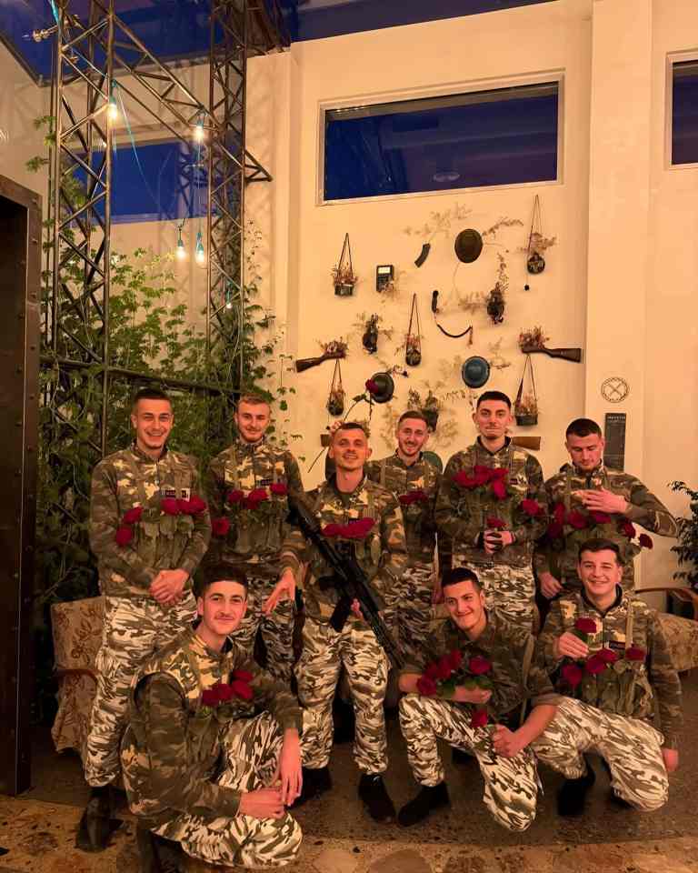 Group of visitors wearing camouflage uniforms at an ex-military base experience near Tirana