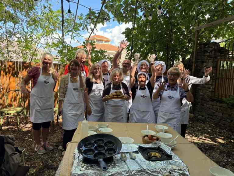 A group at an outdoor cooking class in Gjirokastra, Albania