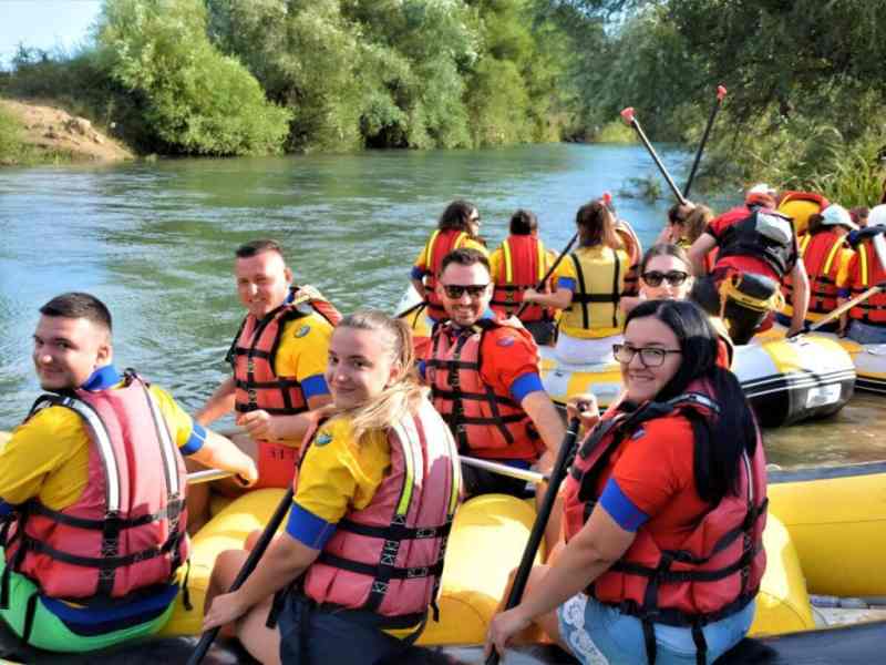 Rafters in red life jackets paddling the green Bistrica River near Saranda in southern Albania