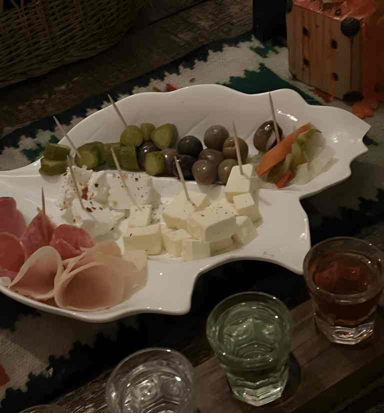 A dish of olives, cheese and cured meat served with raki at a tasting in Tirana