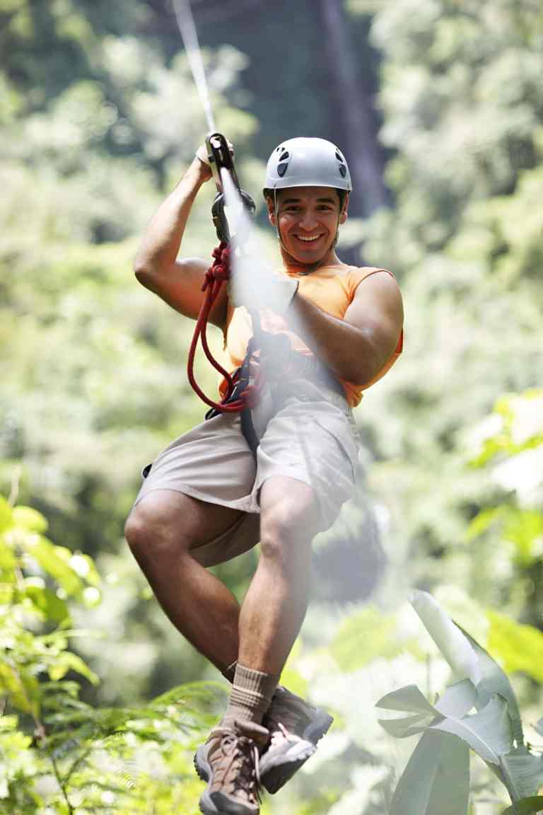 Man setting off down the zipline in Theth