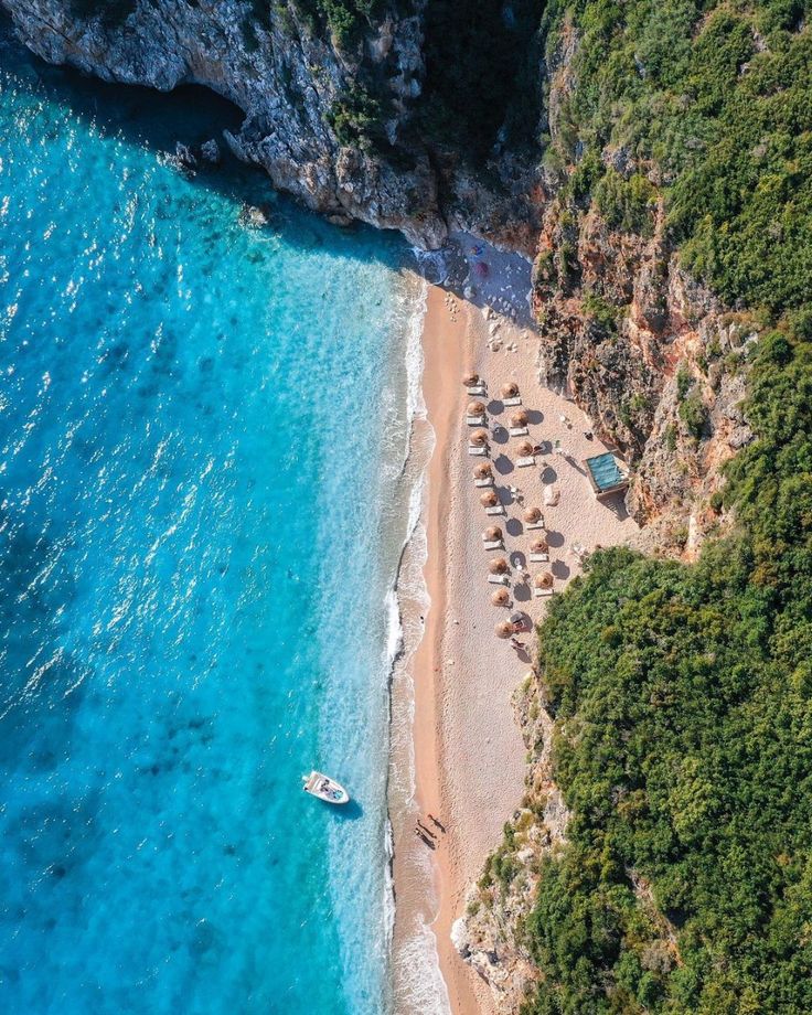 Hidden Ionian beach with turquoise water seen from above on the boat day from Saranda