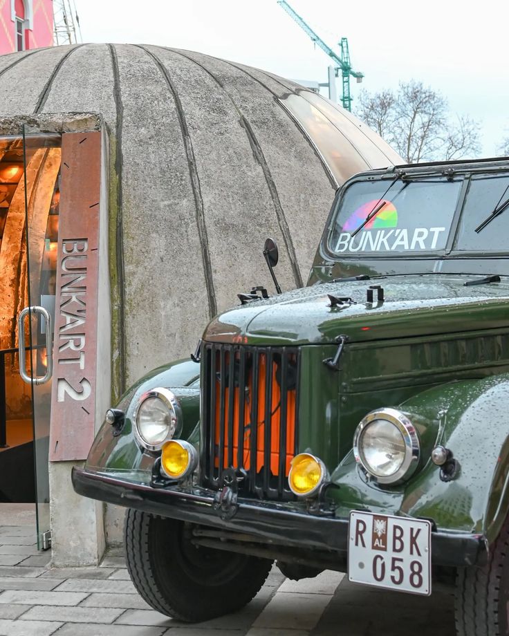 Entrance of the Bunk’Art bunker museum in Tirana with a vintage army jeep
