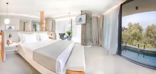 Bright luxury suite with floor-to-ceiling glass and sea view, Albania