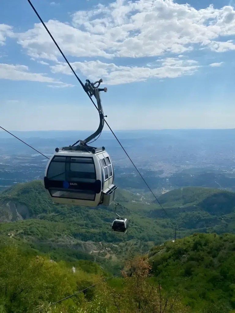 Dajti Ekspres cable car travelling over the mountains above Tirana