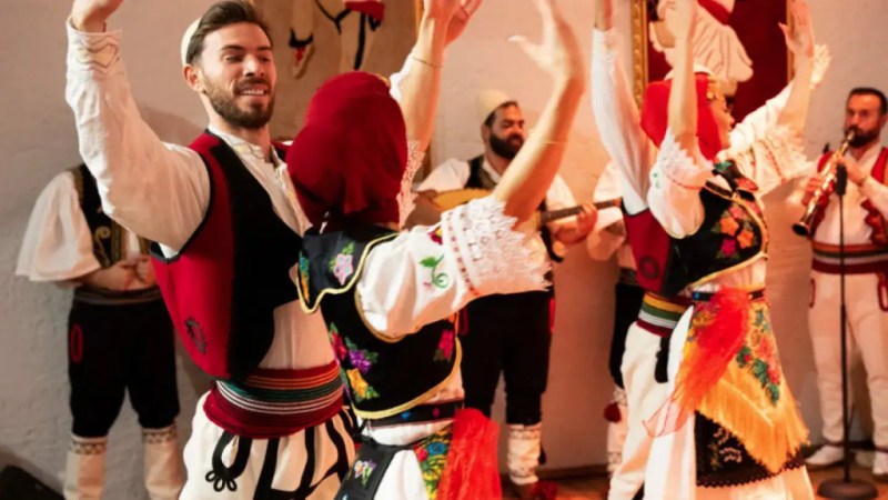 Albanian folk dancers performing in traditional dress during a private culture tour
