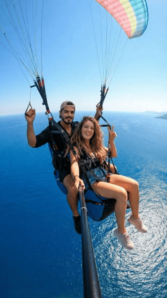 Tandem paragliding flight over the coast near the Llogara Pass, Albania